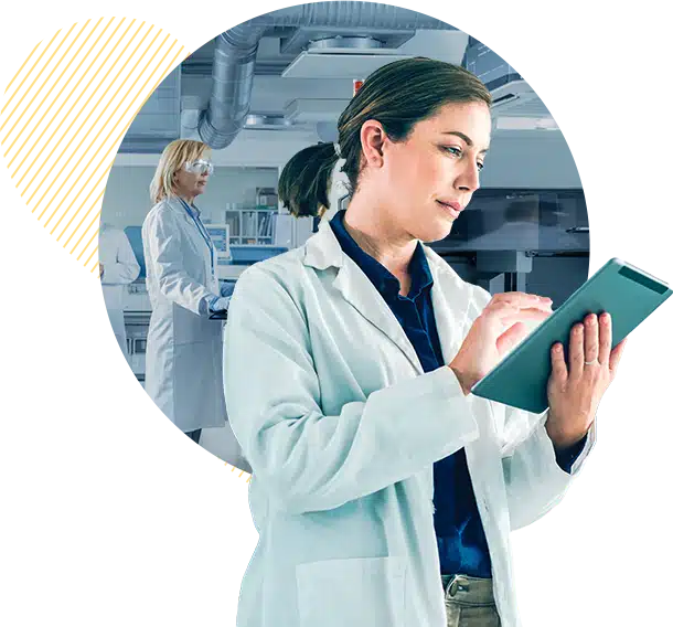 Woman in lab coat viewing data on tablet